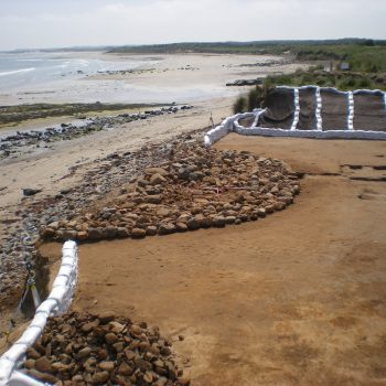 The half-eroded Bronze Age burial cairn once exposed and cleaned of loose sand. © Copyright ARS Ltd 2018