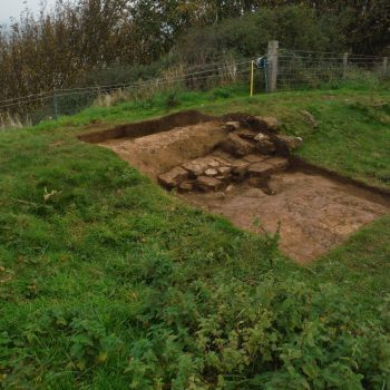 Trench 4 at Stoupe Brow showing a wall and floor surface.