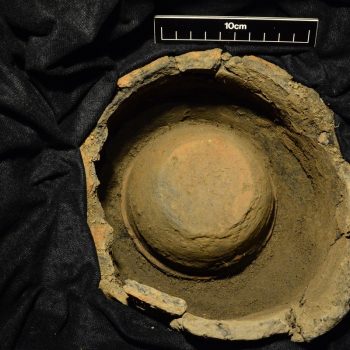 The smaller, inverted collared urn containing the cremation material within the larger urn (scale = 10cm). © Copyright ARS Ltd