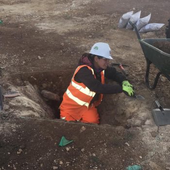 Ana working on the Roman Iron Age palisade construction trench. © Copyright ARS Ltd