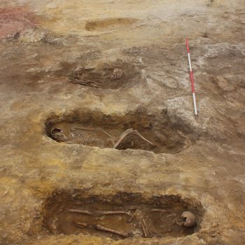 Five of the eleven early medieval graves. Note the preservation of the rock-cut graves in the foreground compared to those that had been cut into sand, in the background, and had therefore suffered more damage due to ploughing (scale = 2 x 2m). © Copyright ARS Ltd