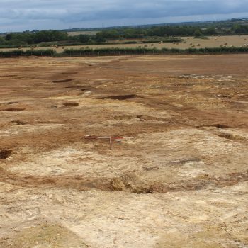 Two probable stock enclosures bordered to the south by the sweeping arc of a Roman field boundary ditch (scales = 2 x 2m). © Copyright ARS Ltd