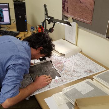 Aerial photograph interpretation underway using a stereoscope.