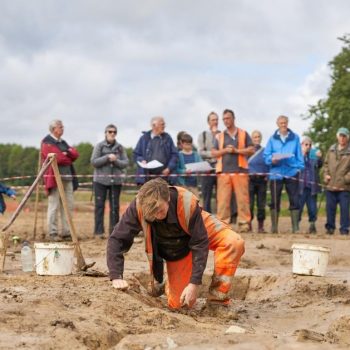 A member of our team excavating as visitors from the open day look on. © Copyright Sam Devito