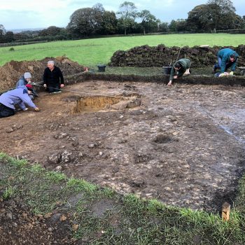 Members of ARS and The Time Travelers begin excavation of the area around the pit.