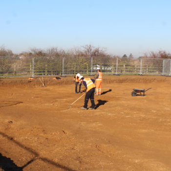 Our fieldwork team using hoes to clean the surface of the ground in order to better identify archaeological features. © Copyright ARS Ltd 2020