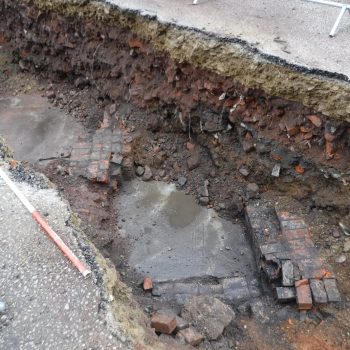 Walls and floor associated with late 19th – early 20th century basement in Trench 3. © Copyright ARS Ltd 2020