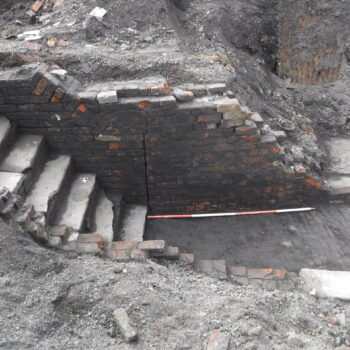 Staircase leading down from the external courtyard towards a set of cellars which included 19th century boiler and furnace rooms © Copyright ARS Ltd 2022