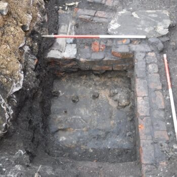 North-eastern boundary wall of the Salford Iron works with external drains and yard at the top of image © Copyright ARS Ltd 2022