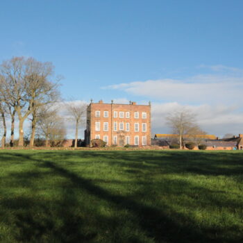 View of the Grade II* Listed Longnor Hall from the parkland to the south © Copyright ARS Ltd 2022